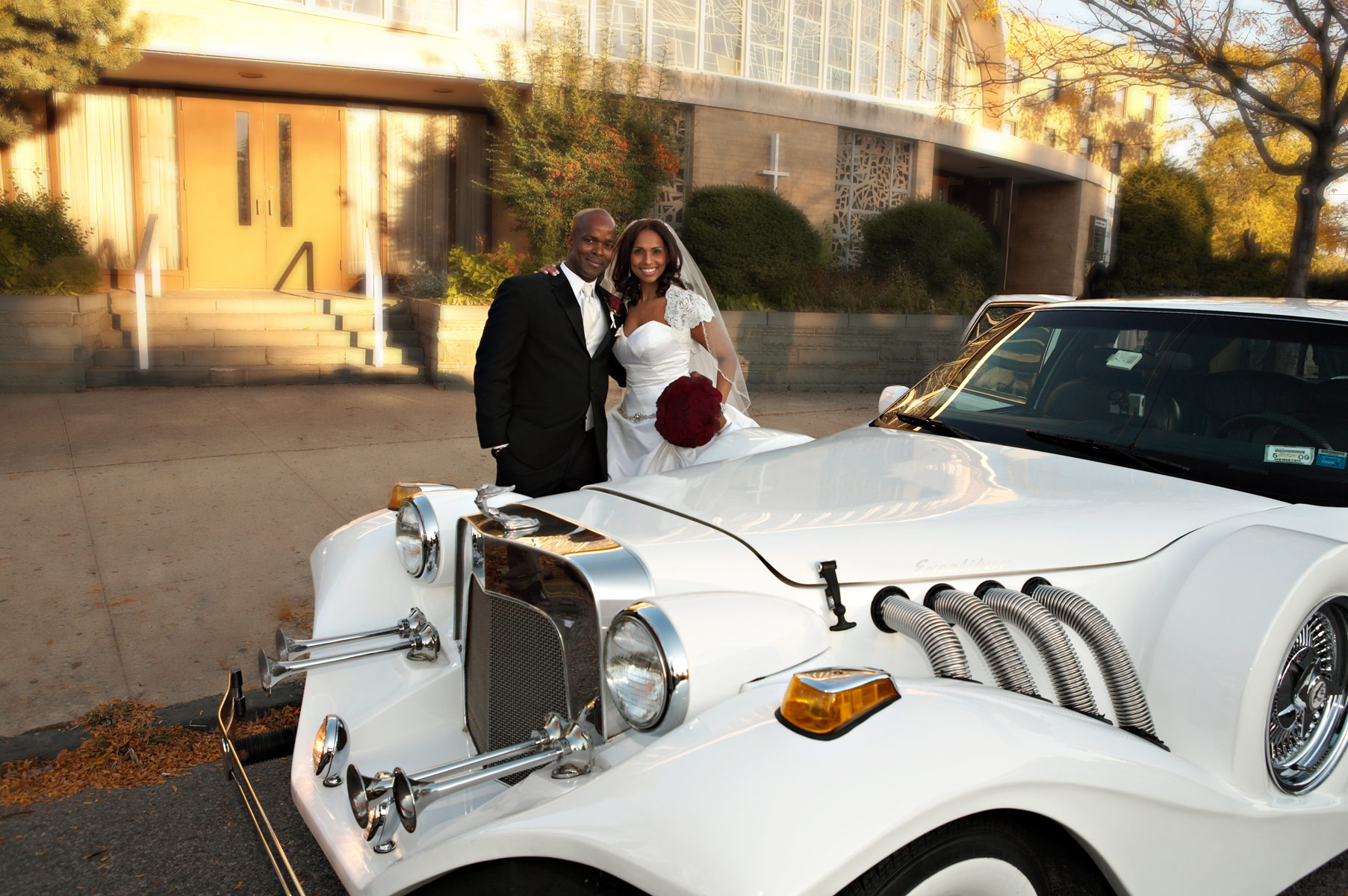 Bride and Groom at the limo